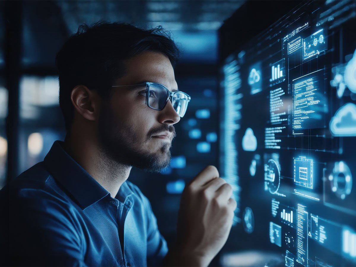 man-studying-high-tech-display-on-screen-WEB